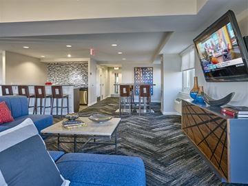 New Brunswick apartment for rent - a living room with couches and chairs and a television