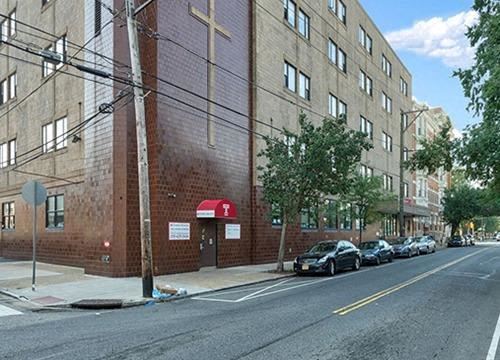 Philadelphia apartment for rent - a brick building on the corner of a city street