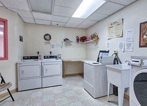 Philadelphia apartment for rent - a laundry room with white appliances and a counter