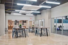 Philadelphia apartment for rent - A modern office space with a dining area in the foreground.