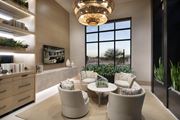Tucson apartment for rent - A modern living room with a large window, a sofa, a chair, and a table.