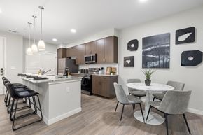 Tucson apartment for rent - A modern kitchen with a dining table and chairs.