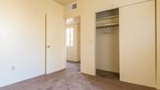Tucson apartment for rent - Bedroom with closet and brown carpet