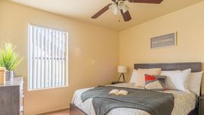 Tucson apartment for rent - Enclave bedroom with natural lighting and ceiling fan