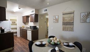 Tucson apartment for rent - A kitchen with a table set for a meal.