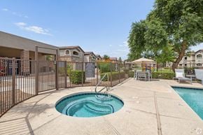 Casa Grande apartment for rent - A small pool with a slide in the middle of a concrete patio.