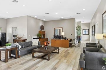 Casa Grande apartment for rent - A living room with a grey couch and a wooden coffee table.