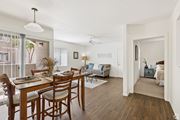 Casa Grande apartment for rent - A dining room with a table set for six with a view of the outside.