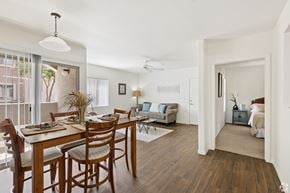 Casa Grande apartment for rent - A dining room with a table set for six with a view of the outside.