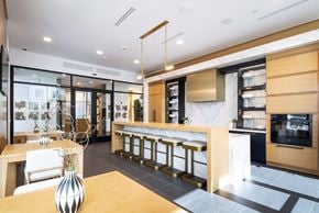 Tucson apartment for rent - a kitchen and dining area with a bar and a table with chairs
