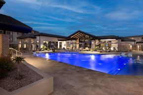 Marana apartment for rent - A large outdoor swimming pool with a blue light reflection at the bottom.