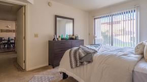 Tucson apartment for rent - villas at Montebella bedroom with with nice natural lighting and carpet flooring