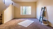 Tucson apartment for rent - Living room with large window and rug, stairs on left