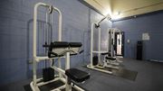 Tucson apartment for rent - A gym with a row of weight machines.