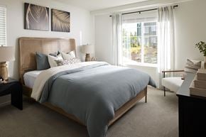 Lacey apartment for rent - a bedroom with a bed and a large window