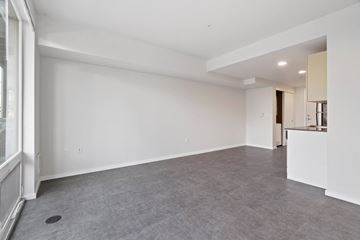 Seattle apartment for rent - the living room and kitchen of a new home with no furniture