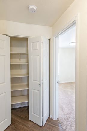 Enumclaw apartment for rent - a bedroom with a closet and an open door
