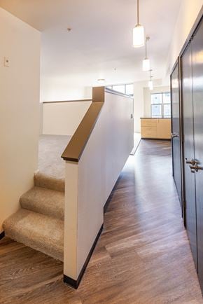 Sammamish apartment for rent - a hallway with stairs and a partition wall in a building