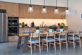 Port Orchard apartment for rent - a large kitchen with a long wooden table and chairs