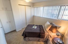 Seattle apartment for rent - a bedroom with a bed and a closet