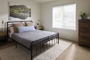 Bremerton apartment for rent - a bedroom with a bed and a dresser