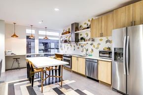 Seattle apartment for rent - A modern kitchen with a dining table and chairs.
