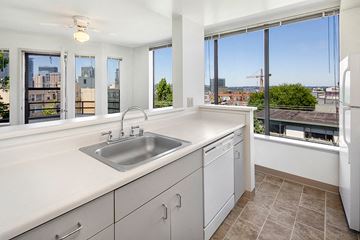 Seattle apartment for rent - a kitchen with a sink and a window