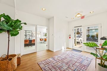 Lynnwood apartment for rent - a living room with white walls and glass doors and a rug