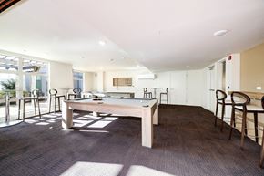 Seattle apartment for rent - a games room with a pool table and chairs