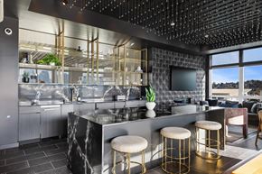 Seattle apartment for rent - a kitchen with a counter and stools in a restaurant