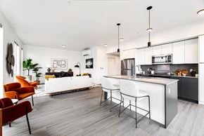 Bellevue apartment for rent - a kitchen and living room with white walls and a white counter top