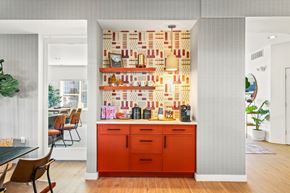 Lynnwood apartment for rent - a kitchen with an orange counter and a wall covered in books