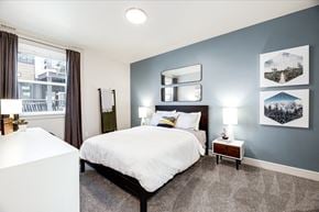 Black Diamond apartment for rent - a bedroom with a large bed and a window
