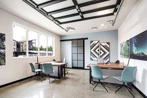 Black Diamond apartment for rent - a conference room with two desks and chairs and large windows