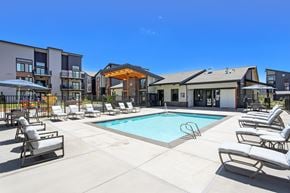 Black Diamond apartment for rent - our apartments offer a swimming pool with lounge chairs and umbrellas