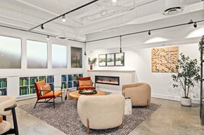 Bellevue apartment for rent - A living room with a fireplace, chairs, and a rug.