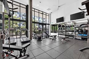 Redmond townhouse for rent - A gym with a variety of equipment including weights and machines.