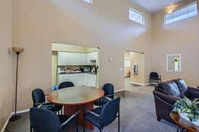 Olympia apartment for rent - A dining room with a round table and chairs.