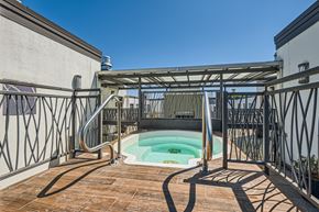 Portland apartment for rent - a plunge pool sits on the balcony of a house with metal railing