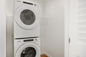 Seattle apartment for rent - Two white Whirlpool washing machines stacked on top of each other.