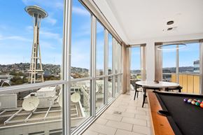 Seattle apartment for rent - a room with a view of the space needle and a pool table