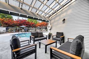 Kent apartment for rent - A patio with a pool and furniture.