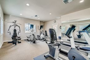 Vancouver apartment for rent - A spacious home gym with a variety of exercise equipment.