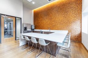 Portland apartment for rent - a conference room with a long table and chairs and a brick wall