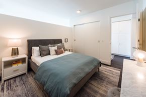 Seattle apartment for rent - a bedroom with a bed and desk in a 555 waverly unit