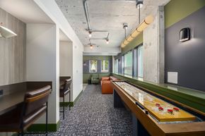 Seattle apartment for rent - A room with a pool table and a bar area.