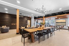 Bend apartment for rent - a dining area with tables and chairs and a fireplace