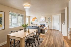 Seattle apartment for rent - A dining room with a wooden table and chairs.