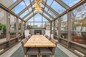 Seattle apartment for rent - a dining room with a wooden table and chairs and a fireplace