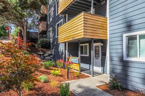 Seattle apartment for rent - A modern house with a blue exterior and a yellow accent wall.